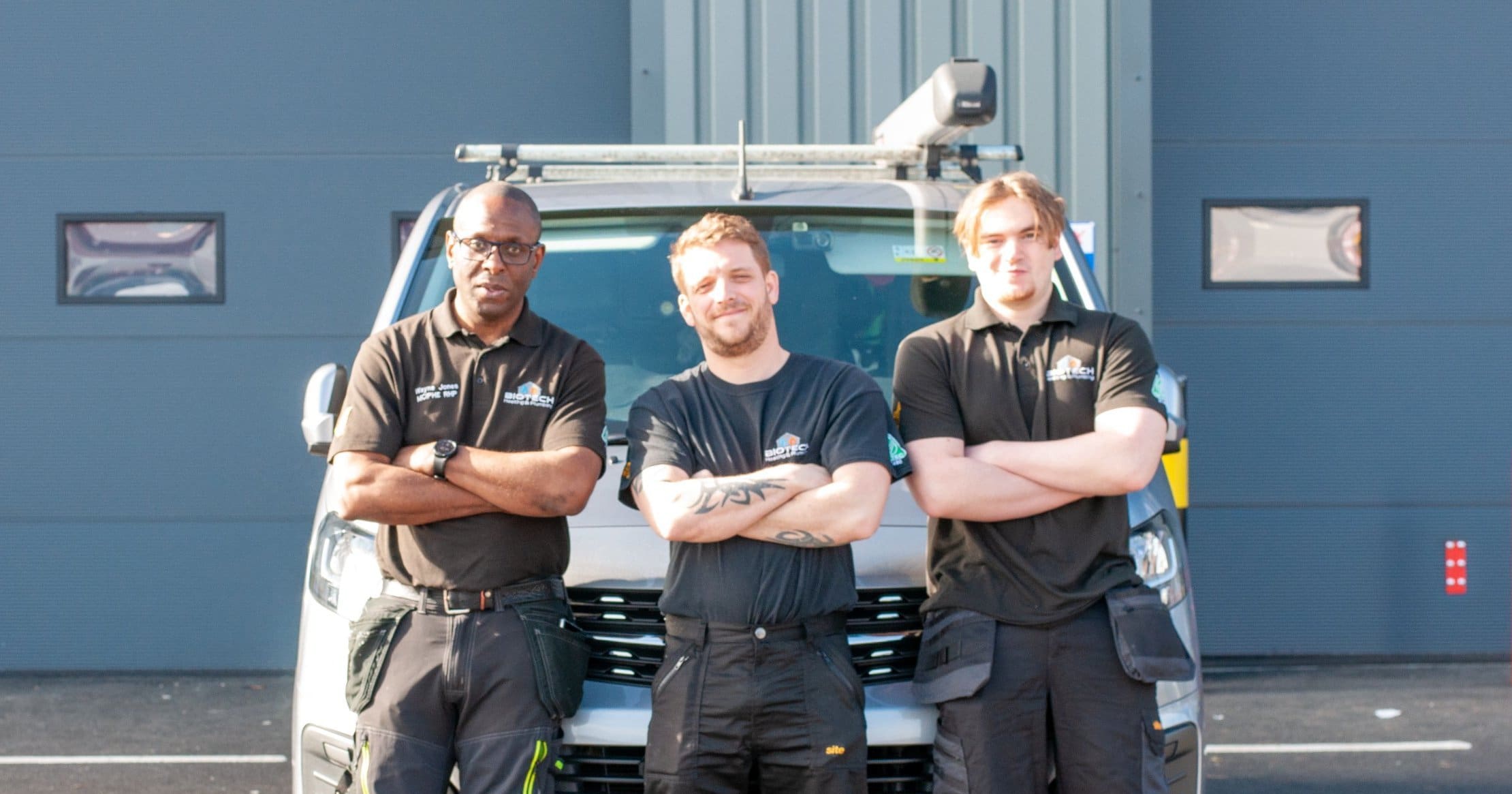 Biotech-27-03-23-056-scaled-e1681904017772 three boilermen standing in front of a truck outside facing the camera and smiling